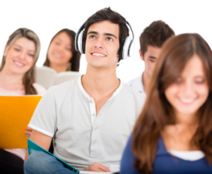 Student listening to music in class with headphones